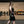 Woman in WOMEN'S WEIGHTLIFTING COMPRESSION SINGLET S-4 standing in a gym (side view) - Warm Body Cold Mind