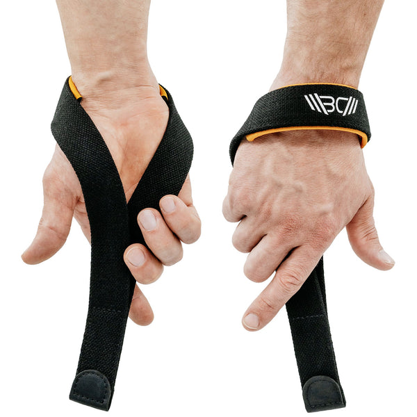 Straps V2 Pro Black with a brand logo being worn on hands against a white background - Warm Body Cold Mind